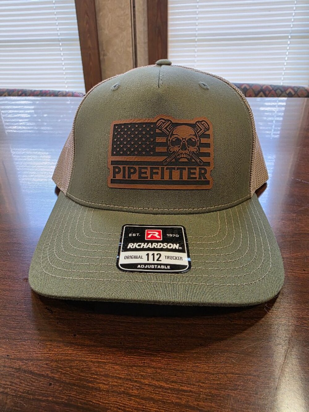 Richardson Olive/Tan Adjustable Mesh Back Trucker Hat "Pipefitter Flag Skull"